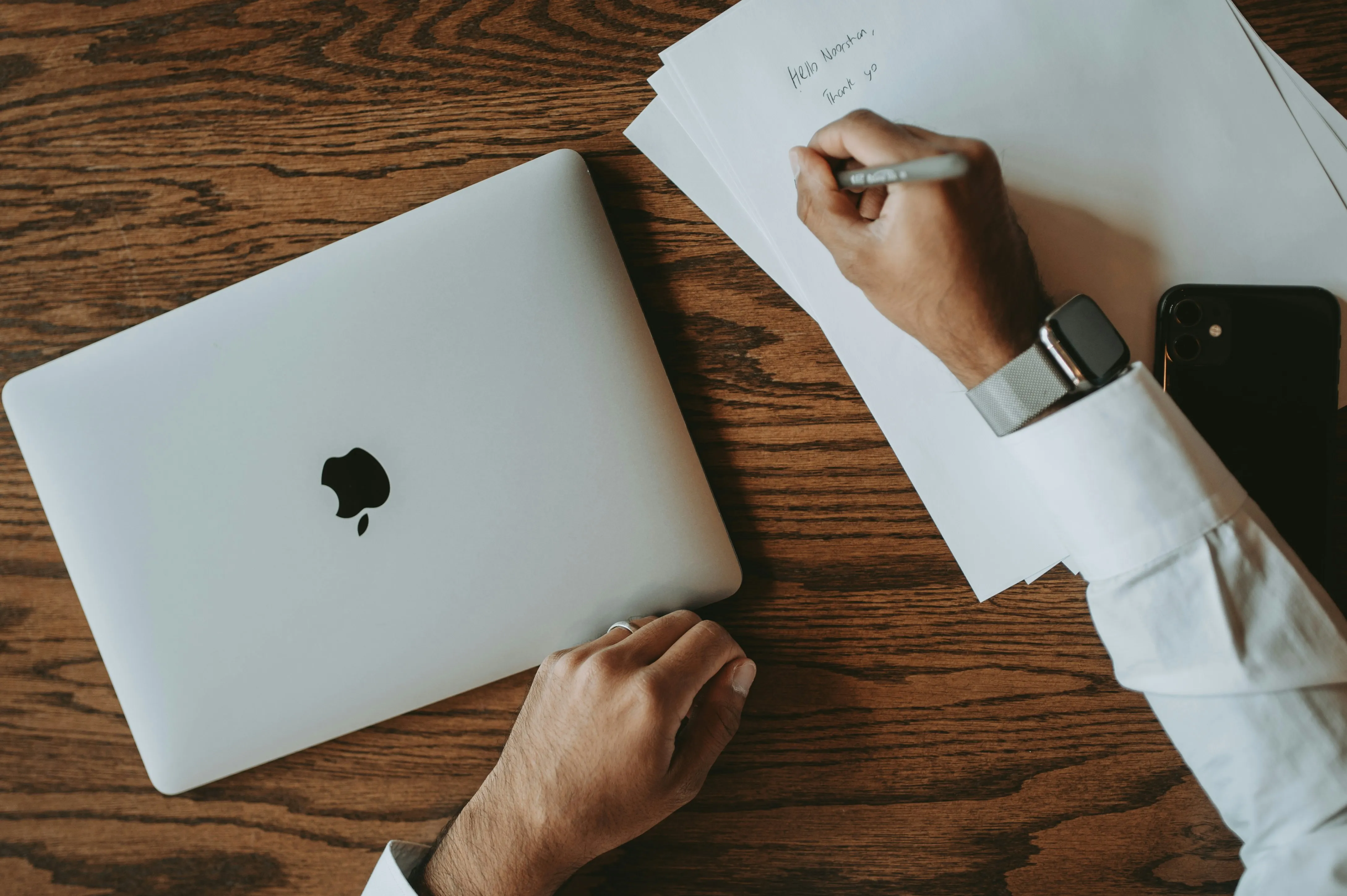 Business owner organizing documentation folders for B Lab verification review